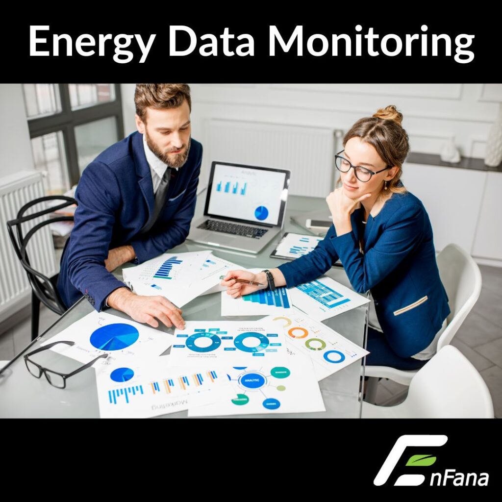 Image of two humans looking at data charts for energy